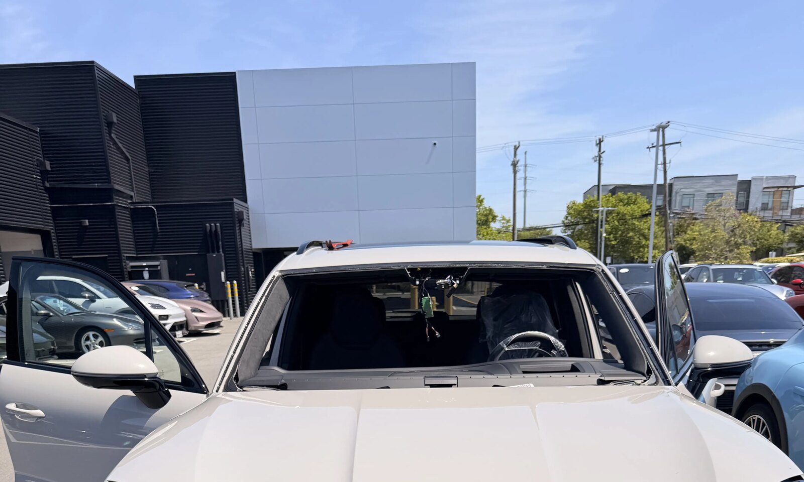 Porsche Cayenne prepped for glass installation and camera recalibration.
